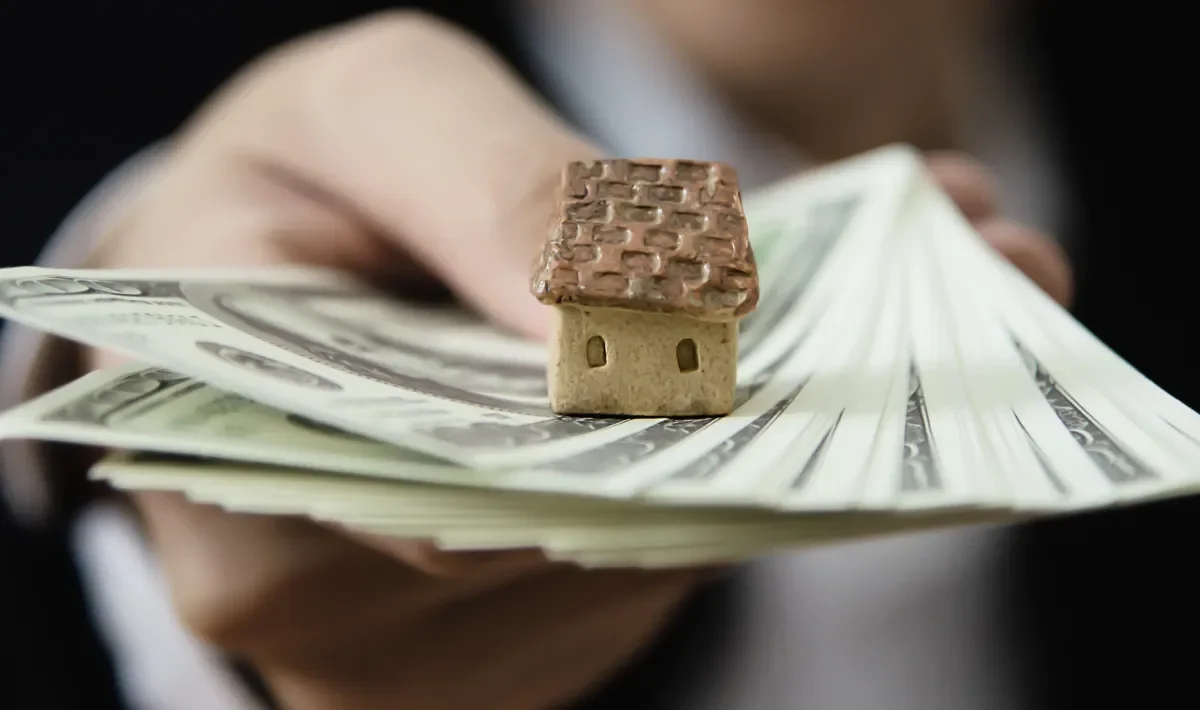 holding out hand with money in hand
