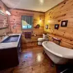 Rustic bathroom with wooden interior.